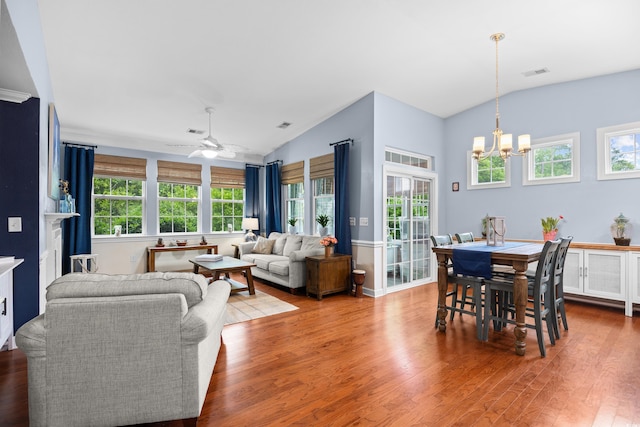 1444 Thames Ct, Myrtle Beach, SC 29577 - living room with vaulted ceiling, wood finished floors, a chandelier, healthy amount of natural light, and ceiling fan