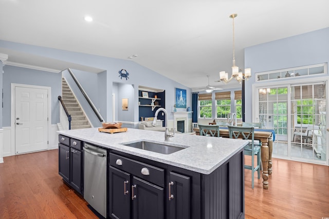 1444 Thames Ct, Myrtle Beach, SC 29577 - kitchen featuring a sink, stainless steel dishwasher, light wood-style flooring, open floor plan, and vaulted ceiling