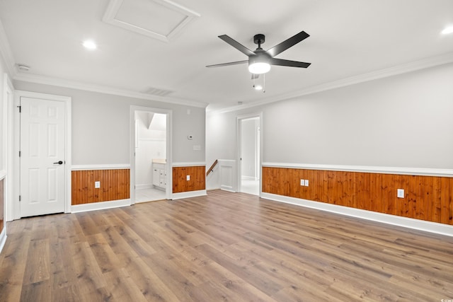 1533 Murrells Landing Rd, Conway, SC 29526 - empty room featuring attic access, wood finished floors, a wainscoted wall, ornamental molding, and a ceiling fan