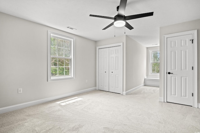 1533 Murrells Landing Rd, Conway, SC 29526 - unfurnished bedroom with multiple windows, light carpet, baseboards, and a ceiling fan
