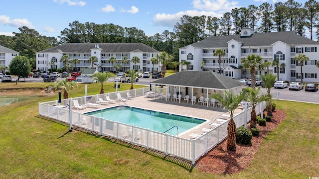 community pool with a residential view