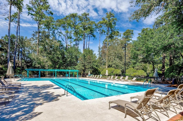 4803 Bucks Bluff Dr, North Myrtle Beach, SC 29582 - community pool with a patio area and view of wooded area