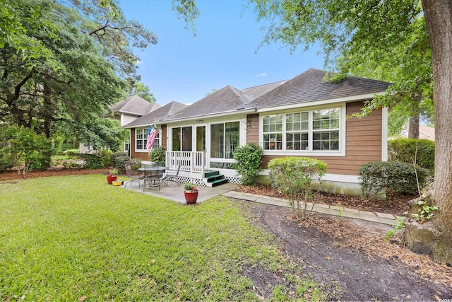 4803 Bucks Bluff Dr, North Myrtle Beach, SC 29582 - rear view of property with a patio area, a lawn, and roof with shingles