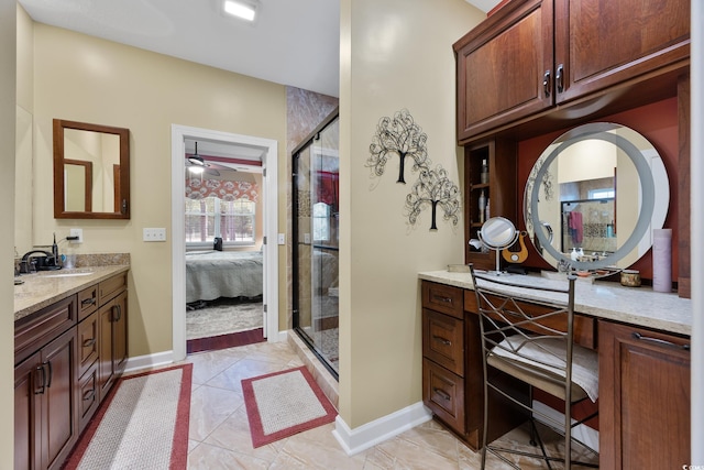 4803 Bucks Bluff Dr, North Myrtle Beach, SC 29582 - ensuite bathroom featuring a stall shower, baseboards, vanity, and ceiling fan