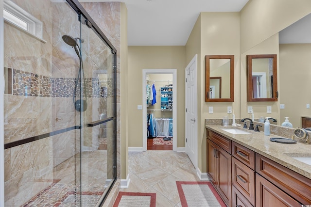4803 Bucks Bluff Dr, North Myrtle Beach, SC 29582 - bathroom with a shower stall, double vanity, a walk in closet, and baseboards