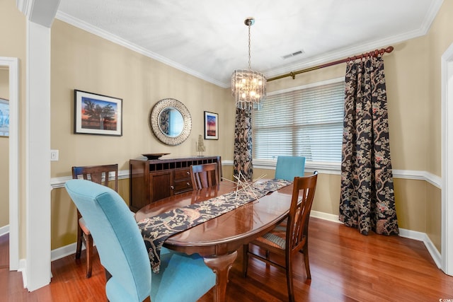 4803 Bucks Bluff Dr, North Myrtle Beach, SC 29582 - dining room with a chandelier, wood finished floors, baseboards, and ornamental molding