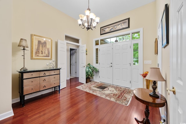 4803 Bucks Bluff Dr, North Myrtle Beach, SC 29582 - entrance foyer with dark wood-style flooring, a chandelier, and baseboards