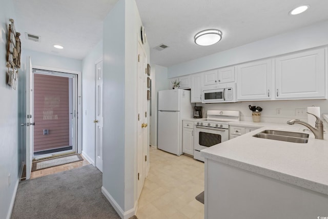 633 Waterway Village Blvd Unit 11D, Myrtle Beach, SC 29579 - kitchen featuring white appliances, a sink, white cabinets, baseboards, and recessed lighting