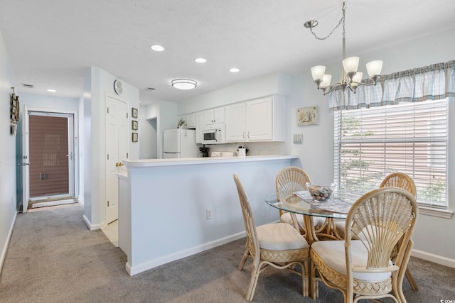 633 Waterway Village Blvd Unit 11D, Myrtle Beach, SC 29579 - dining space with light colored carpet, baseboards, recessed lighting, a chandelier, and healthy amount of natural light