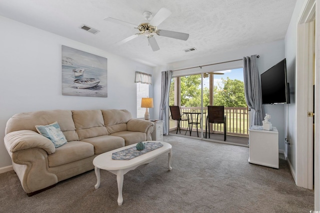 633 Waterway Village Blvd Unit 11D, Myrtle Beach, SC 29579 - carpeted living area with a ceiling fan and a textured ceiling