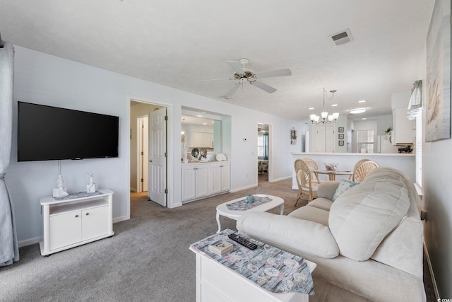 633 Waterway Village Blvd Unit 11D, Myrtle Beach, SC 29579 - living room featuring ceiling fan, a chandelier, baseboards, and carpet