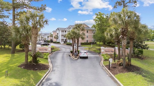 633 Waterway Village Blvd Unit 11D, Myrtle Beach, SC 29579 - view of asphalt street with curbs, a residential view, and a gated entry