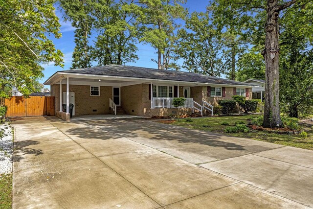 2519 Reta St, Conway, SC 29526 - ranch-style home with driveway, a porch, brick siding, an attached carport, and crawl space