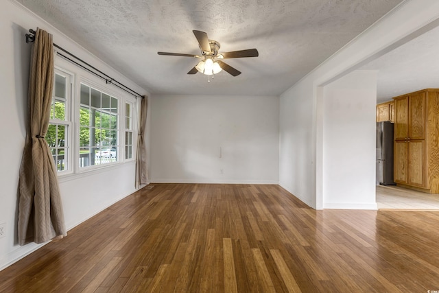 2519 Reta St, Conway, SC 29526 - unfurnished room featuring hardwood / wood-style flooring, ceiling fan, baseboards, and a textured ceiling