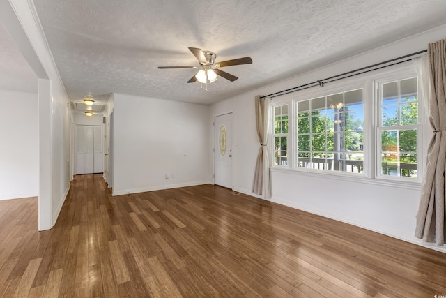 2519 Reta St, Conway, SC 29526 - empty room featuring a textured ceiling, ceiling fan, hardwood / wood-style floors, and baseboards