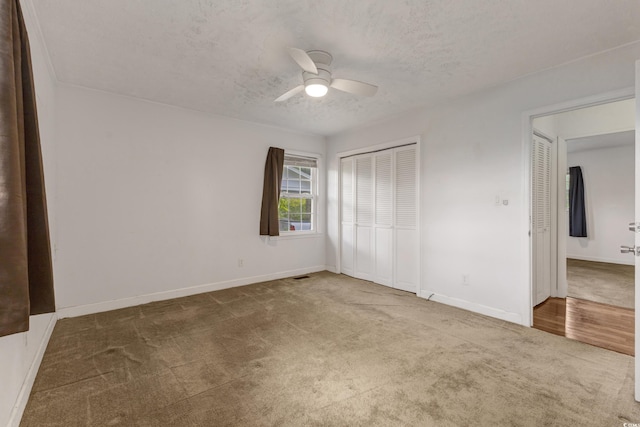 2519 Reta St, Conway, SC 29526 - unfurnished bedroom featuring carpet, a closet, a textured ceiling, baseboards, and a ceiling fan