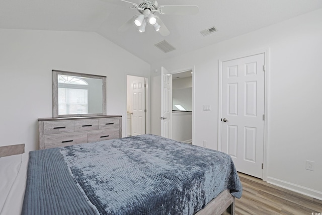 867 Cardinal Pl, North Myrtle Beach, SC 29582 - bedroom with light wood finished floors, vaulted ceiling, a ceiling fan, and baseboards