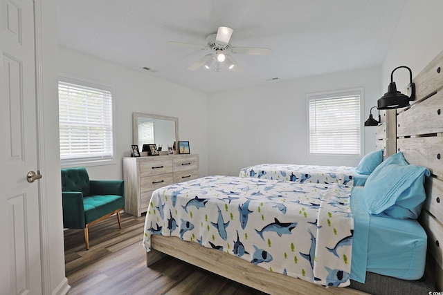 867 Cardinal Pl, North Myrtle Beach, SC 29582 - bedroom featuring multiple windows, wood finished floors, and ceiling fan