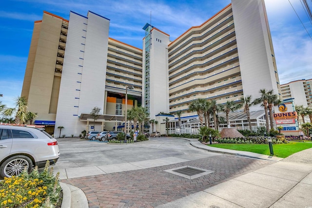 view of property featuring uncovered parking