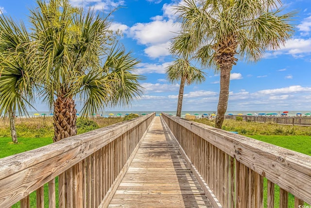 view of community with view of water and beach
