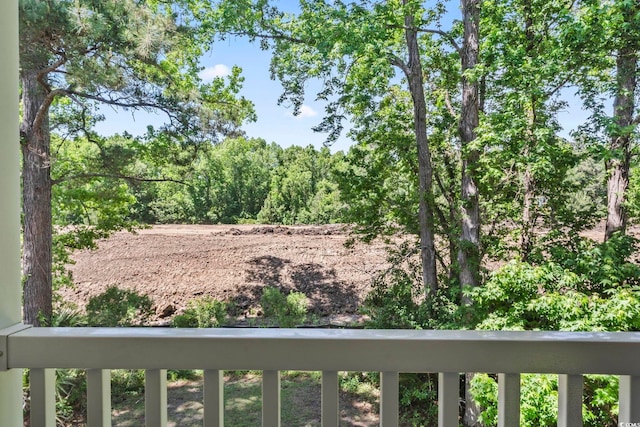 view of yard featuring a balcony