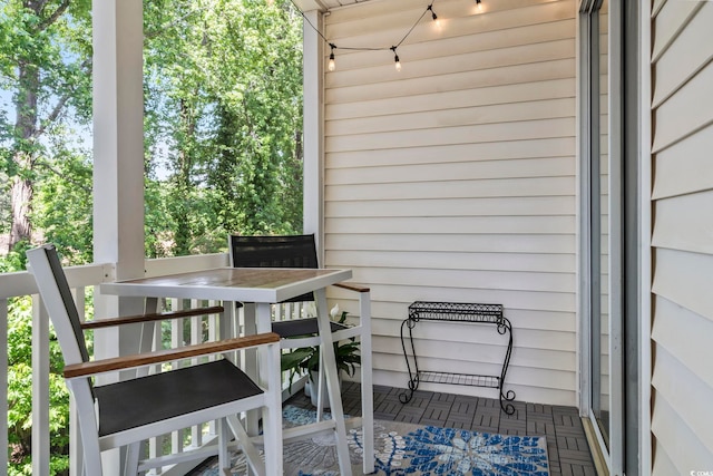 wooden terrace with outdoor dining space