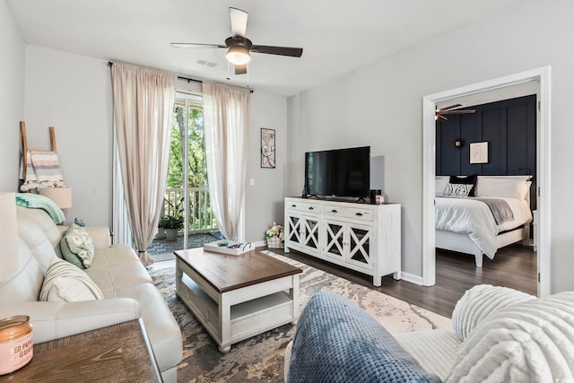 living area featuring a ceiling fan and wood finished floors
