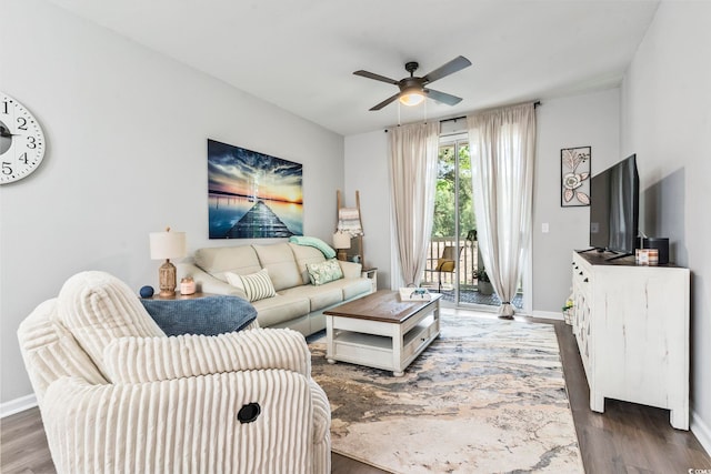 living room with ceiling fan, wood finished floors, and baseboards