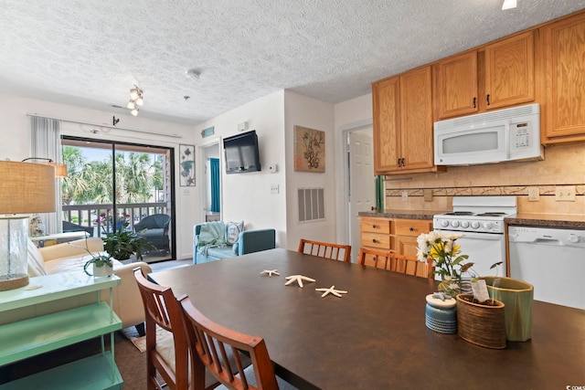 dining room featuring a textured ceiling