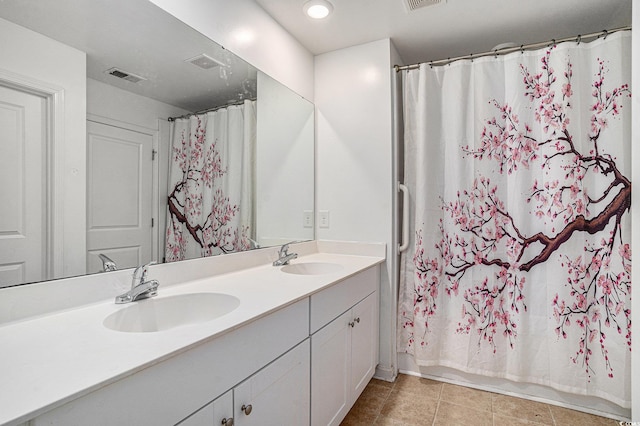 2059 Borgata Loop, Longs, SC 29568 - full bath featuring double vanity, tile patterned floors, and shower / bath combo with shower curtain