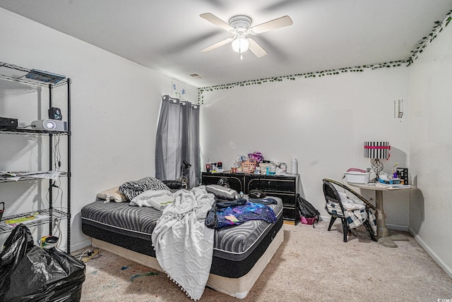 bedroom with baseboards, carpet flooring, and a ceiling fan