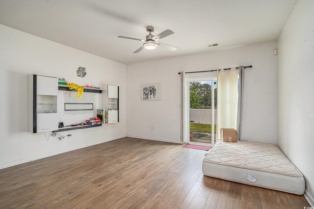 2059 Borgata Loop, Longs, SC 29568 - living area featuring a ceiling fan, wood finished floors, and baseboards