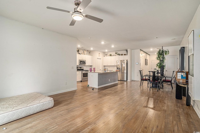 2059 Borgata Loop, Longs, SC 29568 - living area featuring ceiling fan, hardwood / wood-style flooring, recessed lighting, and baseboards