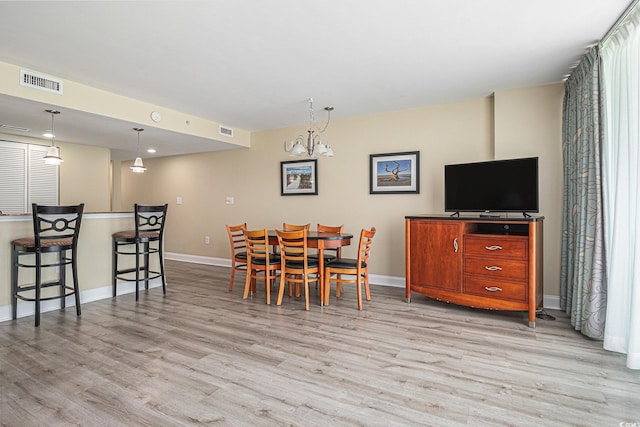 201 S Ocean Blvd Unit 1112, Myrtle Beach, SC 29577 - dining area featuring light wood-style floors and baseboards