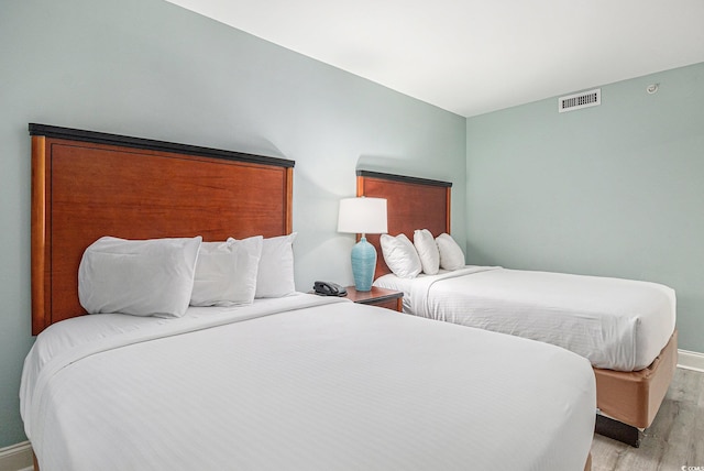 201 S Ocean Blvd Unit 1112, Myrtle Beach, SC 29577 - bedroom featuring light wood-style flooring and baseboards