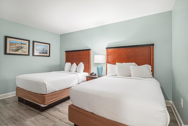 201 S Ocean Blvd Unit 1112, Myrtle Beach, SC 29577 - bedroom featuring wood finished floors and baseboards