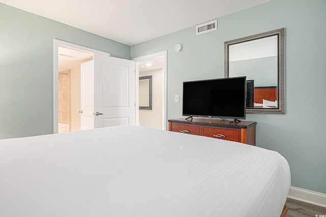 201 S Ocean Blvd Unit 1112, Myrtle Beach, SC 29577 - bedroom featuring baseboards and dark wood-style flooring