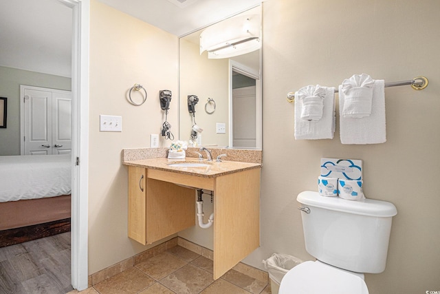 201 S Ocean Blvd Unit 1112, Myrtle Beach, SC 29577 - bathroom featuring toilet, vanity, and baseboards