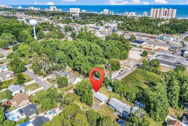 3001 Wiley Dr, North Myrtle Beach, SC 29582 - aerial overview of property's location with a nearby body of water, nearby urban area, and a tree filled landscape
