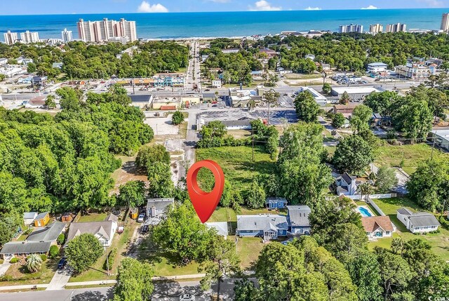 3001 Wiley Dr, North Myrtle Beach, SC 29582 - aerial view of property and surrounding area with a large body of water and a tree filled landscape