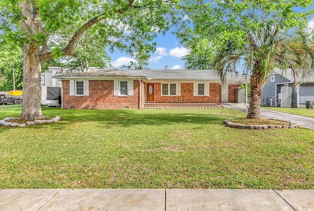 3001 Wiley Dr, North Myrtle Beach, SC 29582 - ranch-style home featuring driveway, a front lawn, brick siding, a carport, and crawl space
