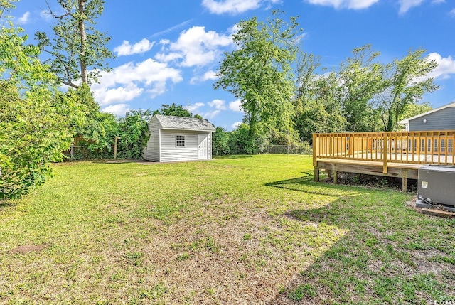 3001 Wiley Dr, North Myrtle Beach, SC 29582 - view of yard featuring an outdoor structure and a wooden deck