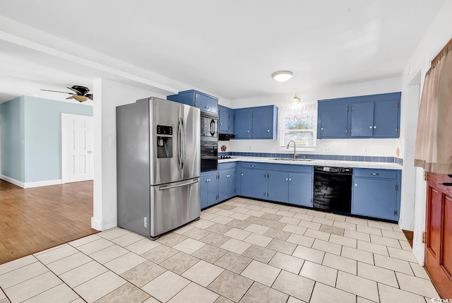 3001 Wiley Dr, North Myrtle Beach, SC 29582 - kitchen featuring black appliances, blue cabinets, a sink, and light countertops