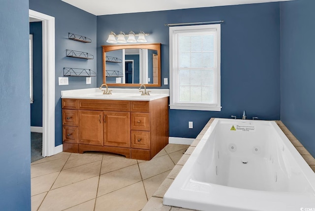 3001 Wiley Dr, North Myrtle Beach, SC 29582 - bathroom with double vanity, a whirlpool tub, baseboards, and tile patterned flooring