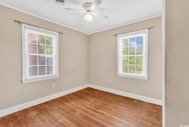 3001 Wiley Dr, North Myrtle Beach, SC 29582 - empty room with crown molding, wood finished floors, ceiling fan, and baseboards