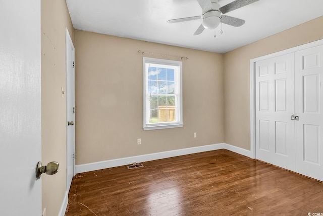 3001 Wiley Dr, North Myrtle Beach, SC 29582 - unfurnished bedroom featuring wood finished floors, baseboards, a closet, and a ceiling fan