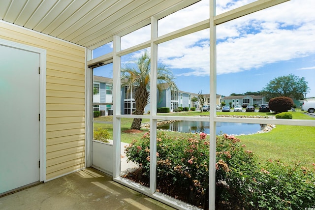 8925 Duckview Dr Unit A, Surfside Beach, SC 29575 - unfurnished sunroom featuring a water view and a residential view