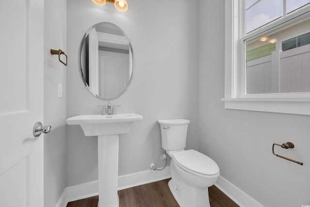 1929 Indigo Cove Ln, Calabash, NC 28467 - half bathroom featuring baseboards, toilet, and wood finished floors