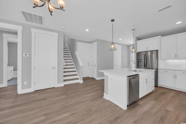 1961 Indigo Cove Ln, Calabash, NC 28467 - kitchen with appliances with stainless steel finishes, a sink, light countertops, recessed lighting, and light wood finished floors