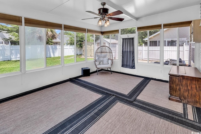 sunroom with ceiling fan and healthy amount of natural light